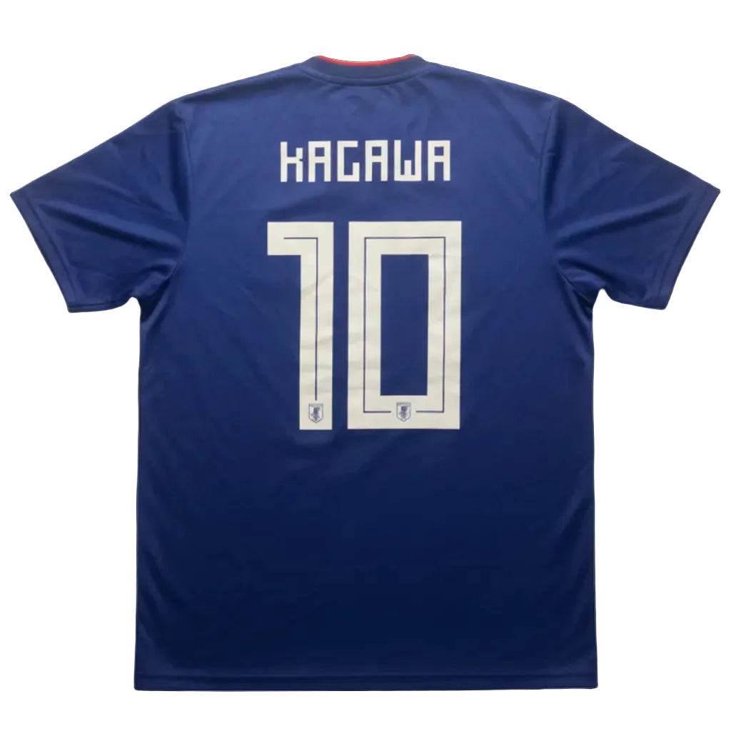 Blue Japan sports jersey with 'KAGAWA' and number '10' on a white surface.