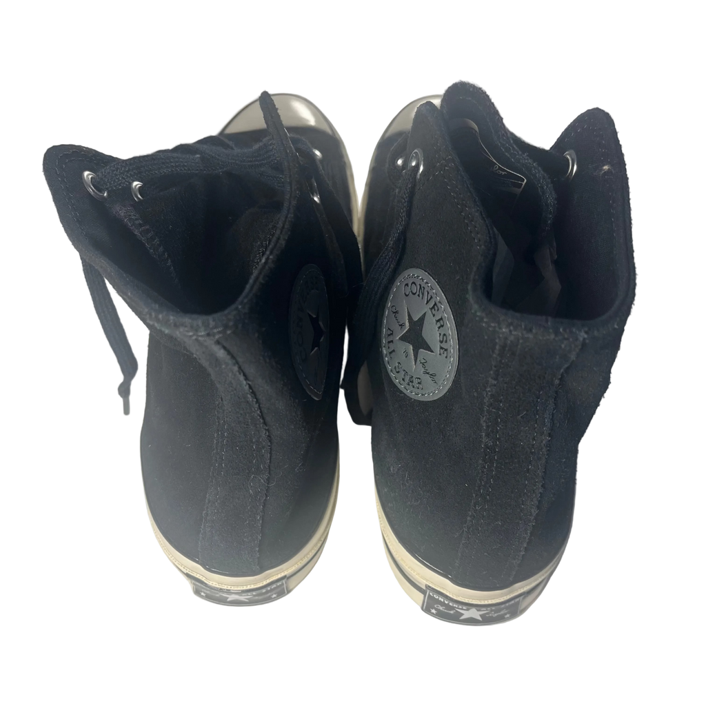 Black high-top sneakers with Converse logo on a white background
