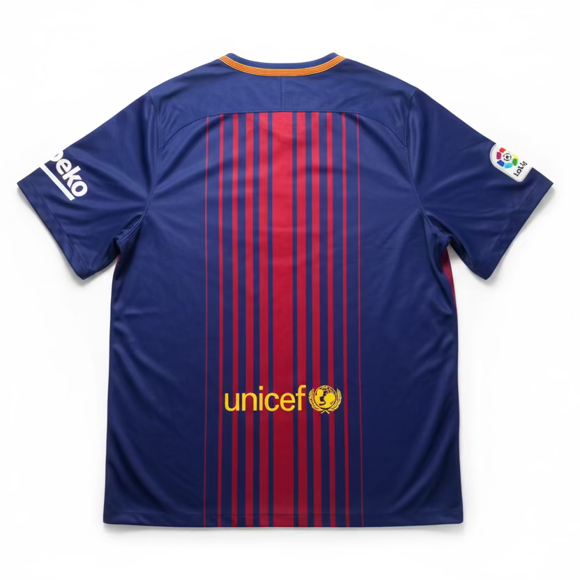 Blue sports jersey with red stripes and Unicef logo on a white background