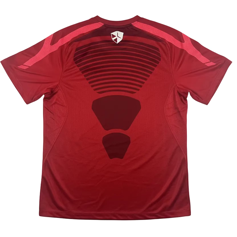 Red t-shirt with black design on a white surface