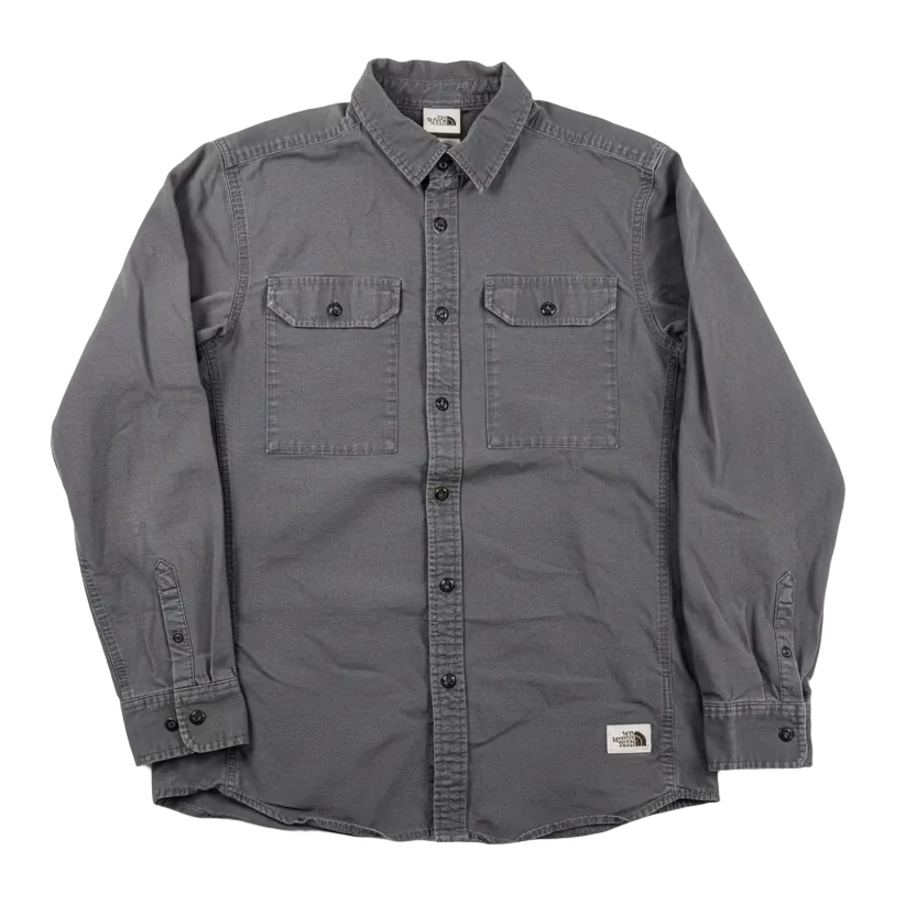 Gray button-up shirt with The North Face logo on a white background