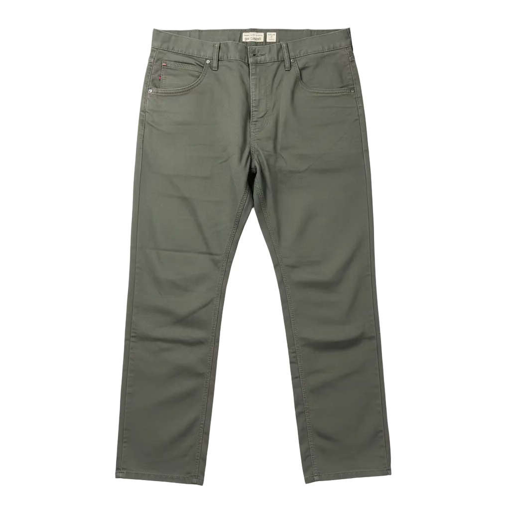 Green pants on a white surface with a blurred background